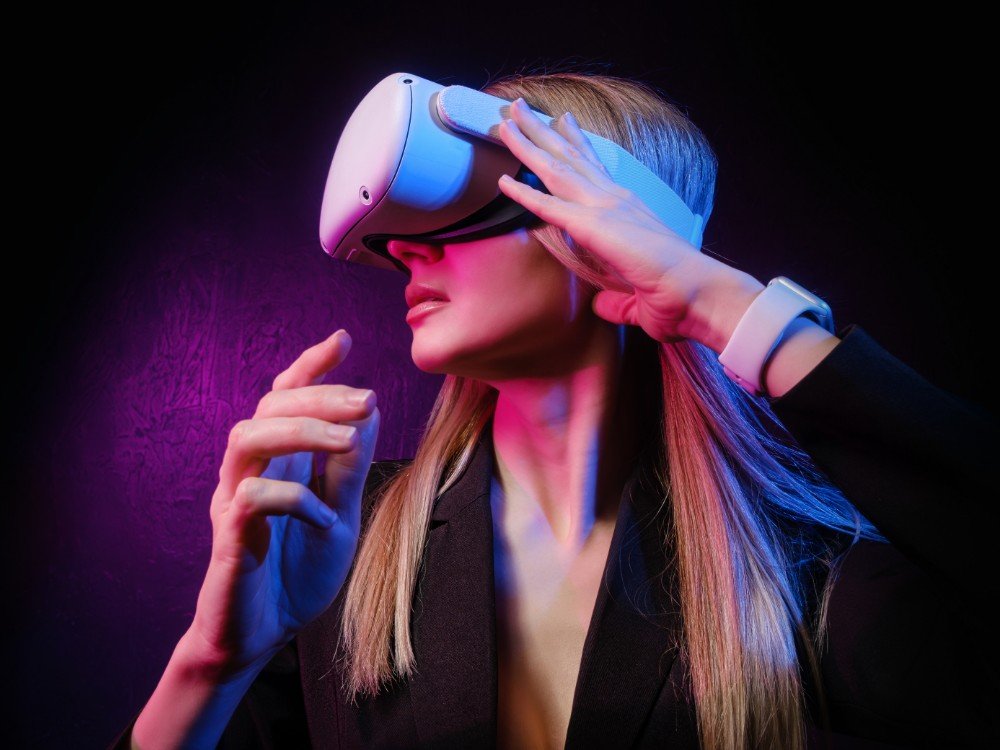 young woman with blond hair vr helmet looks around with surprise delight